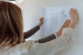 Women looking at a house floor plan